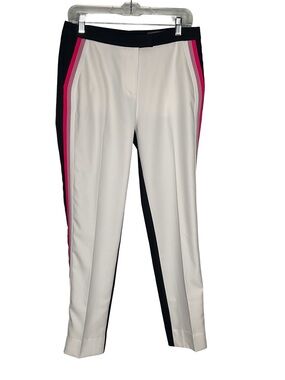 G/FORE White front and navy blue back golf trousers. Luxury golf brand.